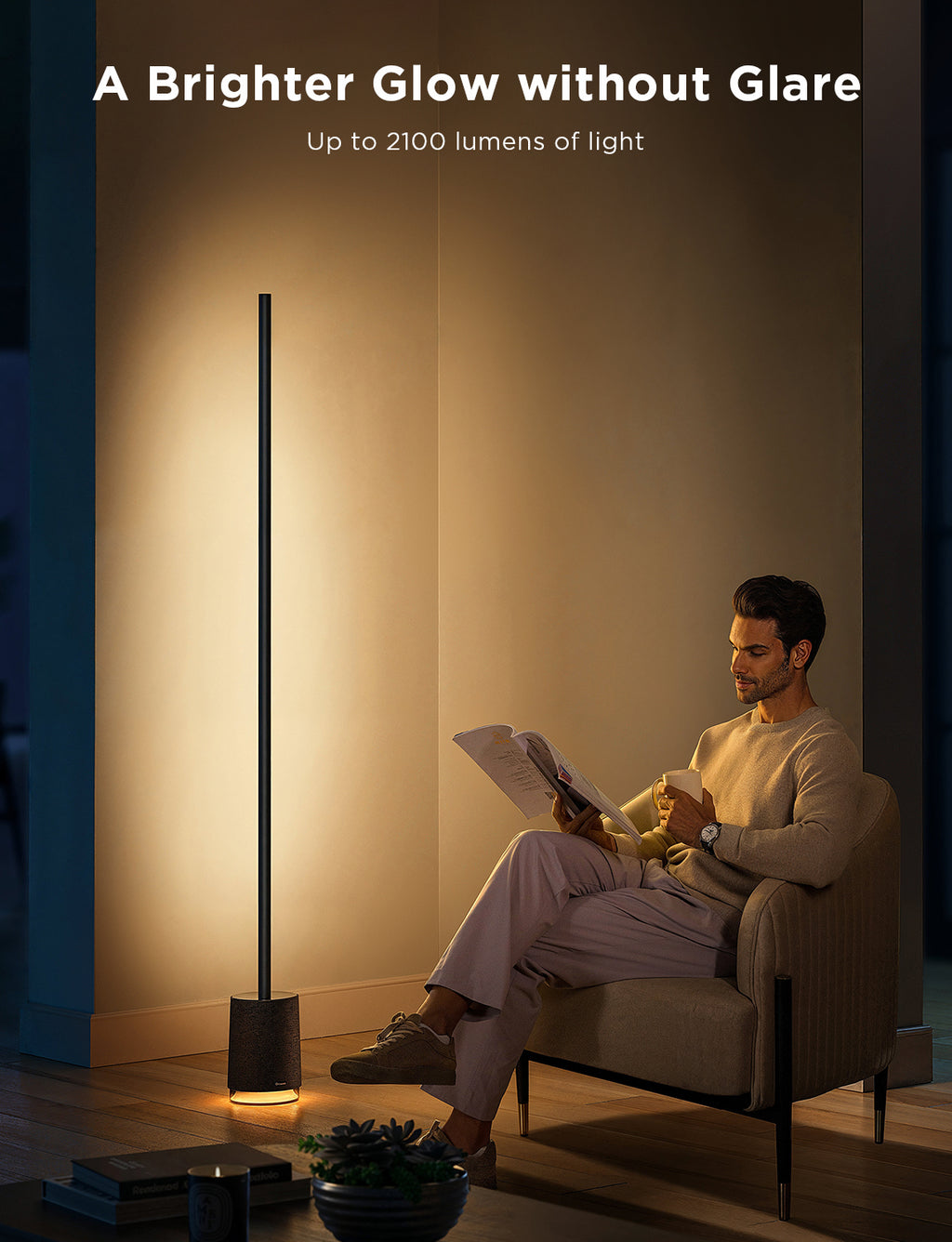 Govee floor lamp with slim black pole and warm light glowing at base