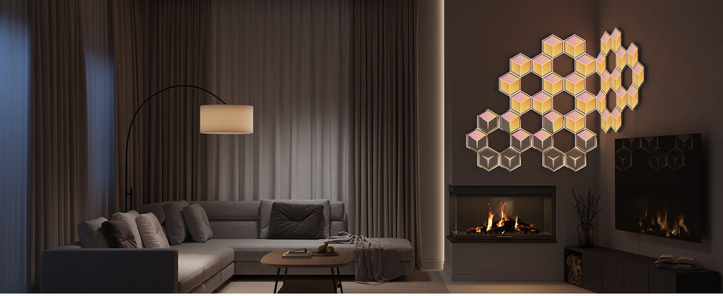 Hexagon LED wall panels with rainbow RGB glow arranged above fireplace