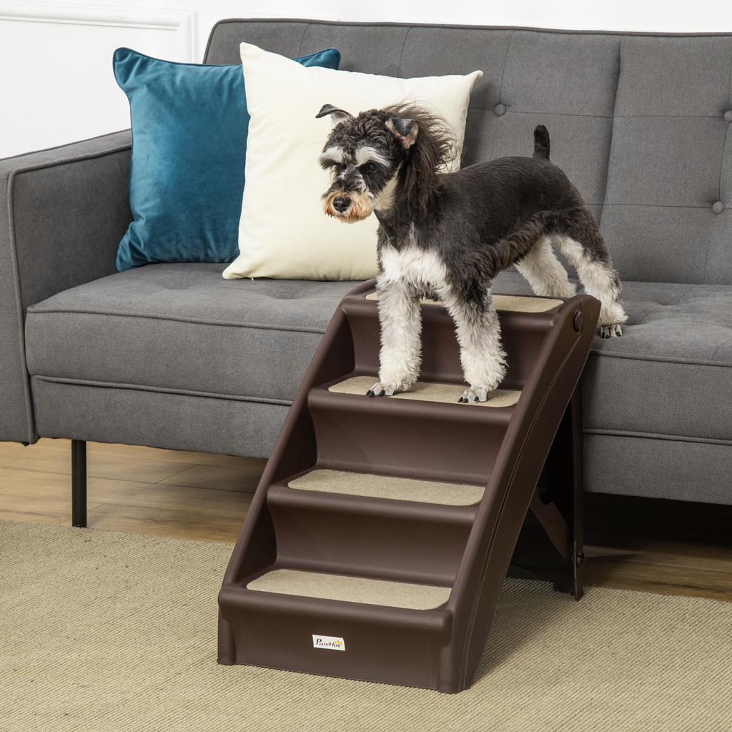 Foldable brown 4-step pet stairs with non-slip treads, shown with a small dog