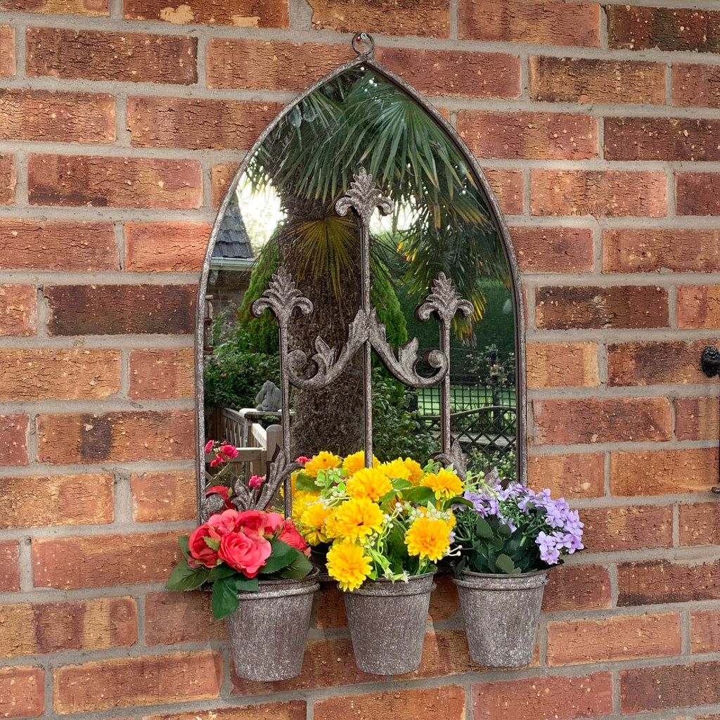 Arched metal wall mirror with triple planters, gray finish, with yellow, pink, and purple flowers