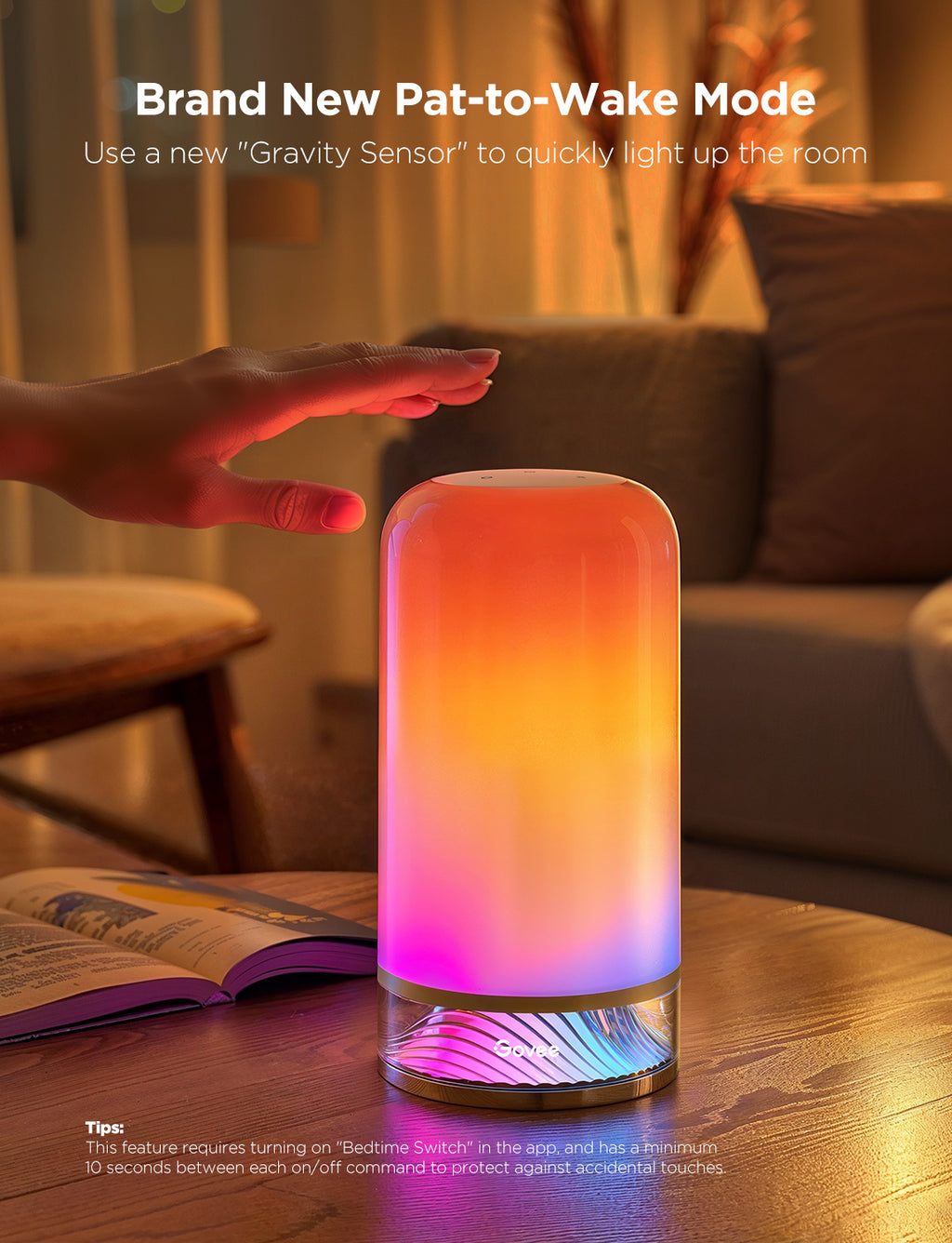 RGB smart table lamp with orange-pink glow triggered by a hand gesture