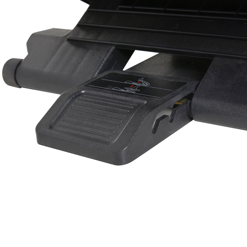 Under-desk footrest underside showing adjustment mechanism and textured pedal