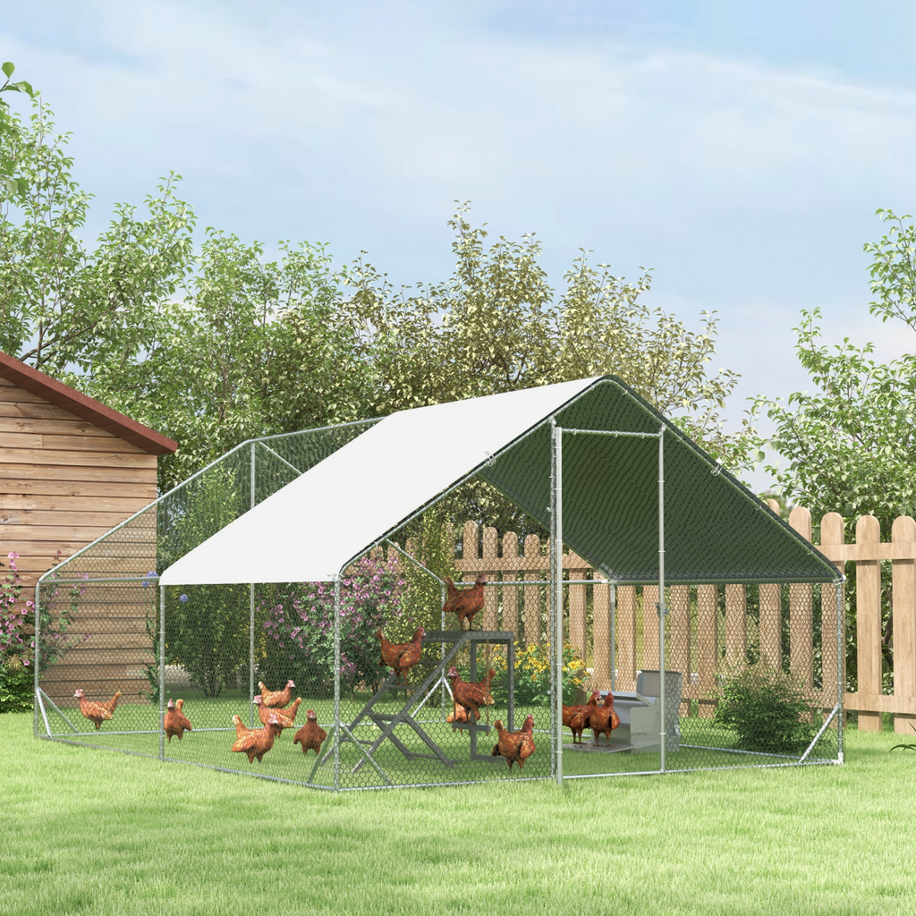 Outdoor chicken coop run with mesh fencing and peaked green roof