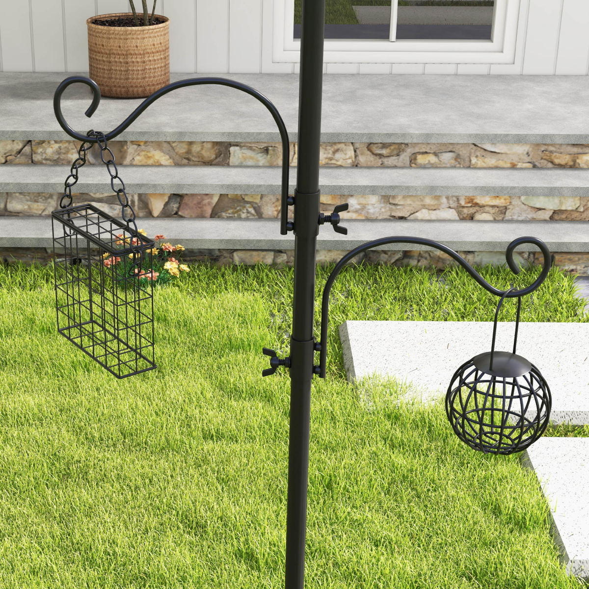 Black bird feeding station post with hanging wire feeder and hanging suet basket