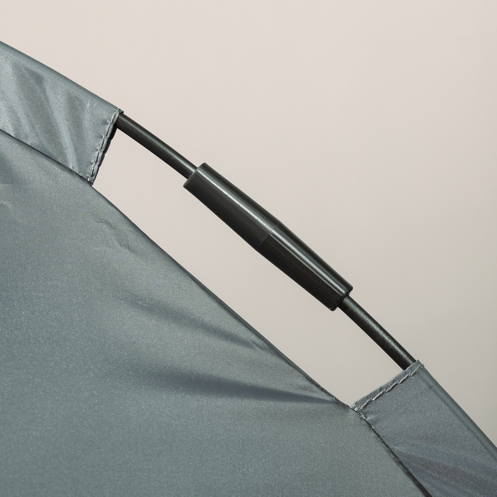 Grey canopy fabric edge with black support tube on elevated dog bed