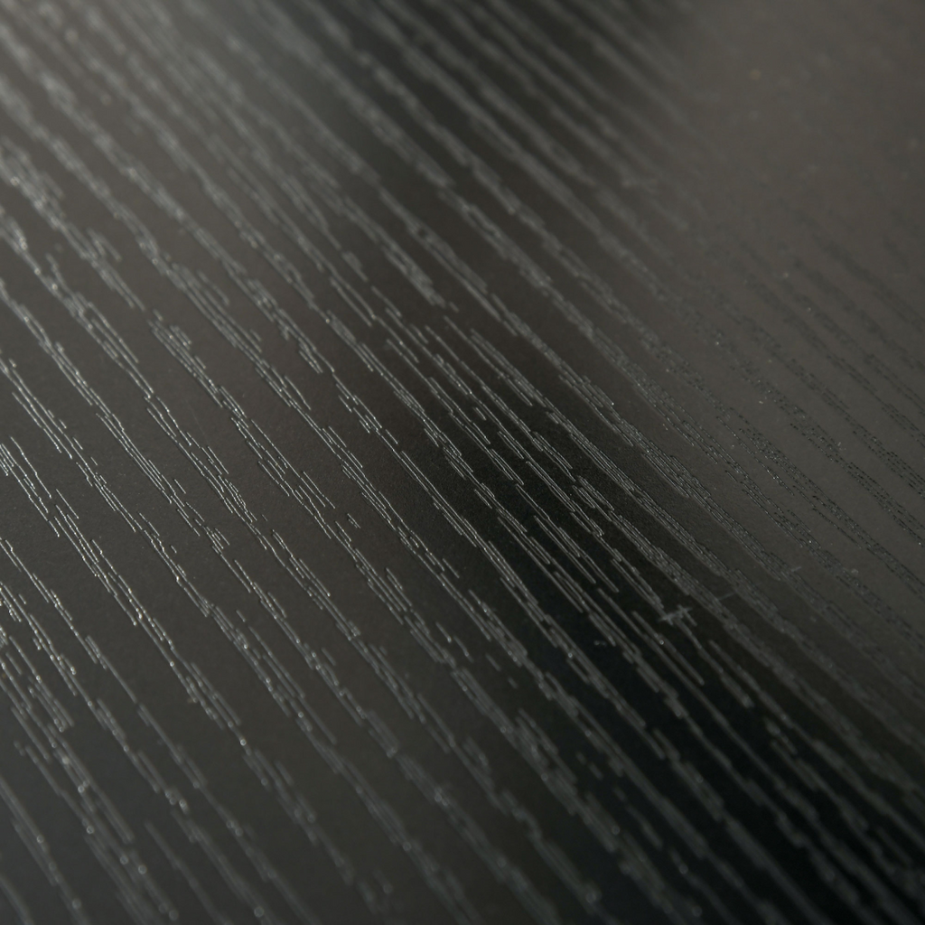 Textured dark surface of the monitor stand riser board with diagonal grain