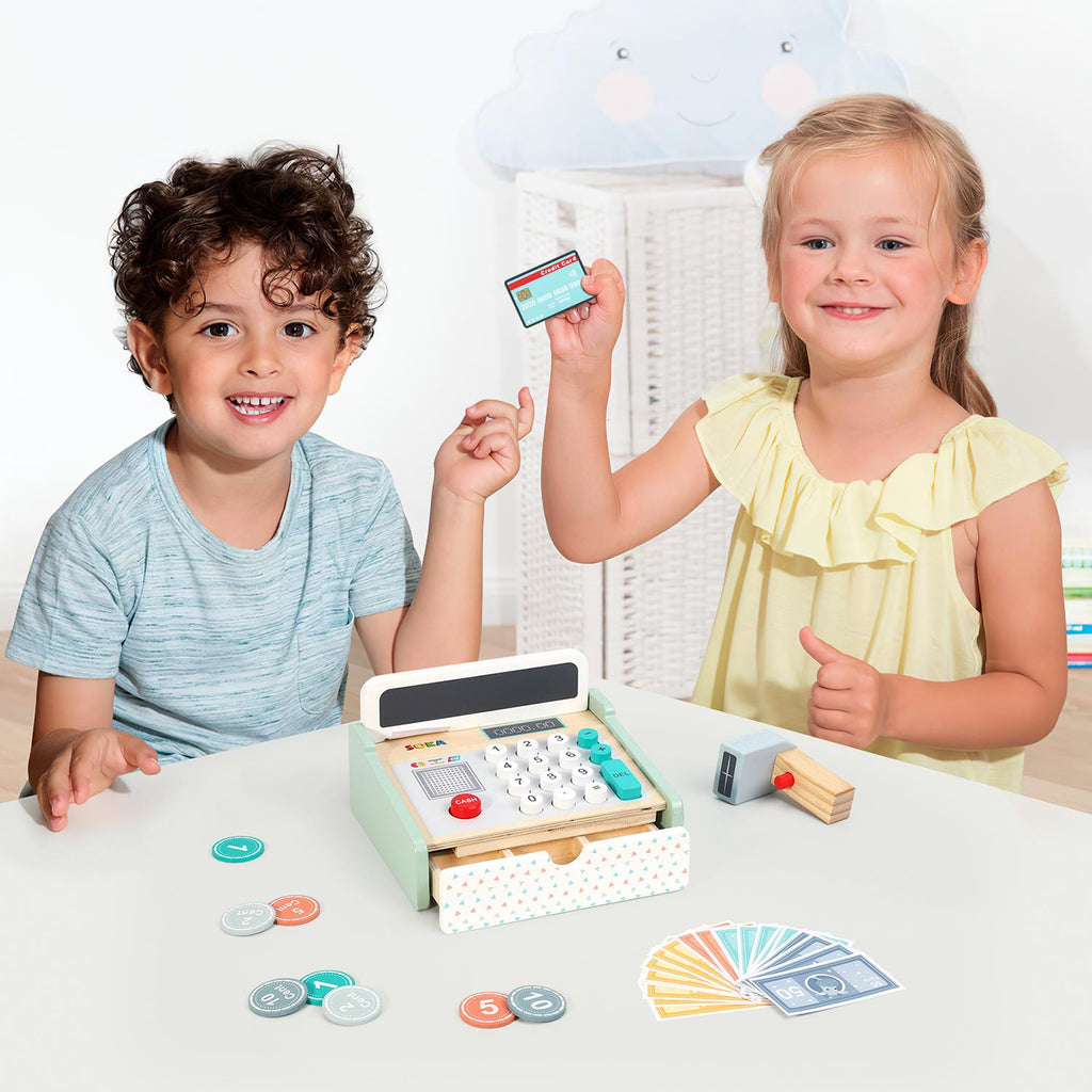Wooden cash register playset with keypad, coin accessories, and card piece on table