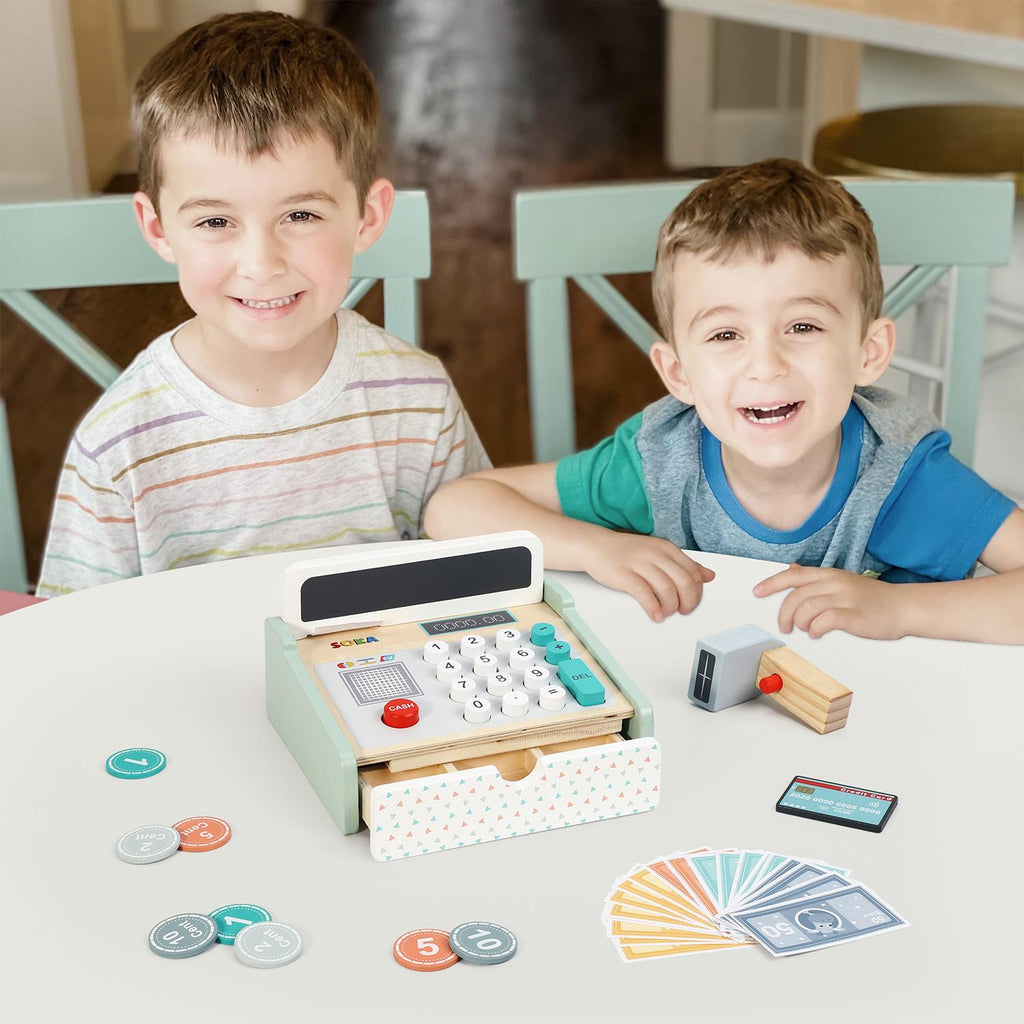 Wooden cash register toy with display, keypad, and scattered play coins and bills