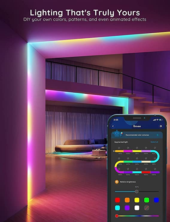 RGBIC LED strip light casting colorful glow along ceiling shelves with phone app