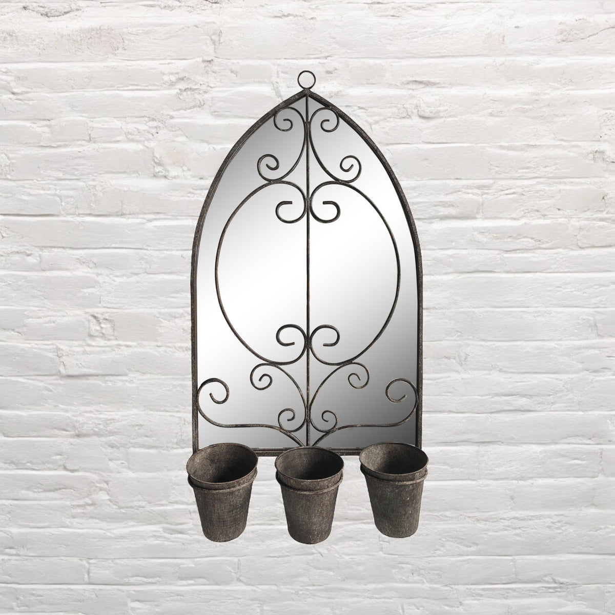 Arched metal wall mirror with scrollwork and three planter cups at the bottom